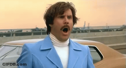 Man In Blue Suit Making Funny Face GIF