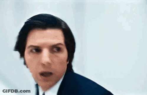 Man In Blue Suit Making Funny Face GIF