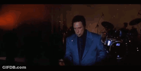 Man In Blue Suit Playing Saxophone In Front Of DW Drum Set GIF