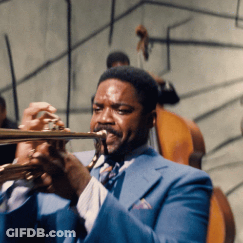 Man In Blue Suit Playing Trumpet GIF