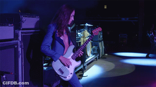 Man In Blue Suit Playing White Guitar GIF