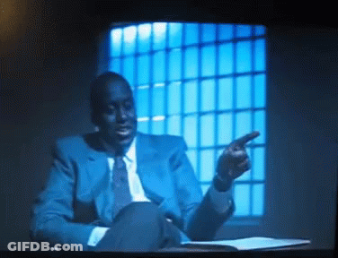 Man In Blue Suit Pointing GIF