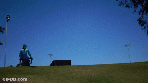 Man In Blue Suit Riding Motorcycle Dumb And Dumber GIF
