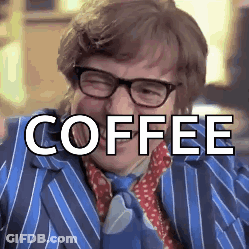 Man In Blue Suit Saying Coffee GIF