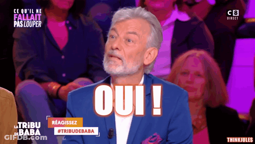 Man In Blue Suit Saying Oui To Crowd GIF