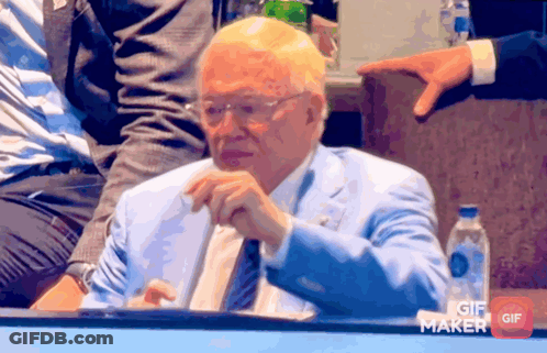 Man In Blue Suit Sitting Before GIF Maker Button GIF