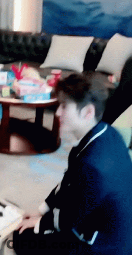 Man In Blue Suit Sitting On Floor GIF