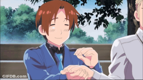 Man In Blue Suit Smiling And Holding Hand GIF