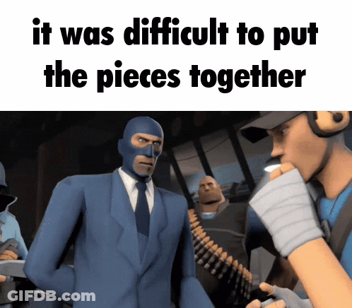 Man In Blue Suit Talking To Man In Mask GIF