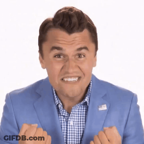 Man In Blue Suit With American Flag Pin Making Funny Face GIF