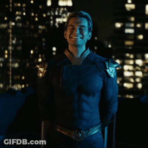 Man In Blue Superhero Costume Smiling GIF