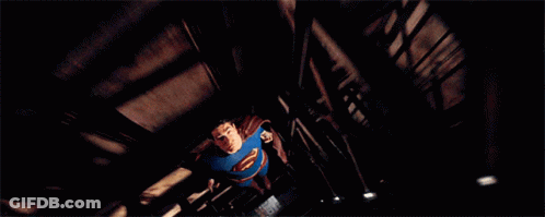 Man In Blue Superman Costume Flying GIF