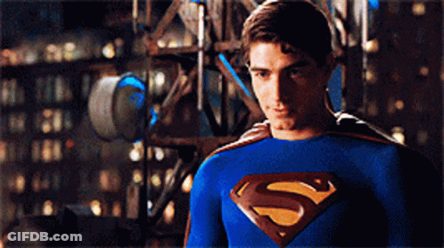 Man In Blue Superman Costume In Front Of Building GIF