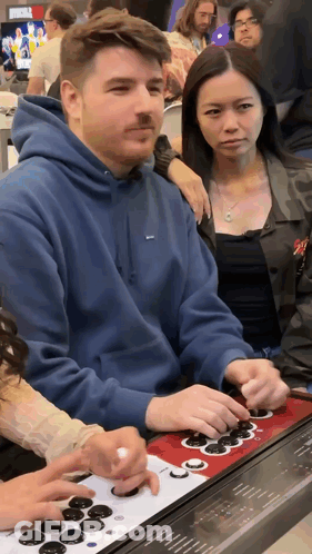 Man In Blue Supreme Hoodie Playing Video Game GIF