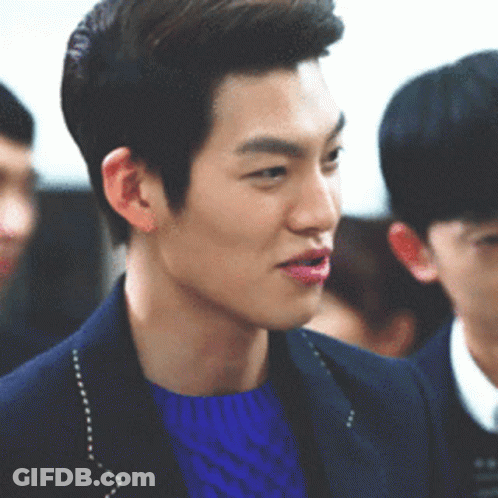 Man In Blue Sweater And Jacket In Crowd GIF