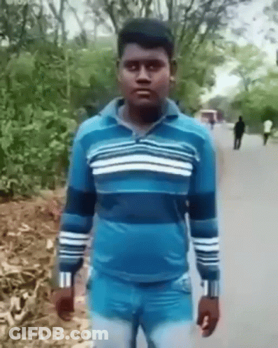 Man In Blue Sweater And Jeans On Road GIF
