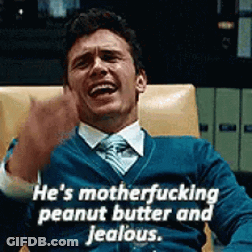 Man In Blue Sweater And Tie Laughing GIF