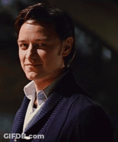 Man In Blue Sweater And White Shirt Smiling GIF