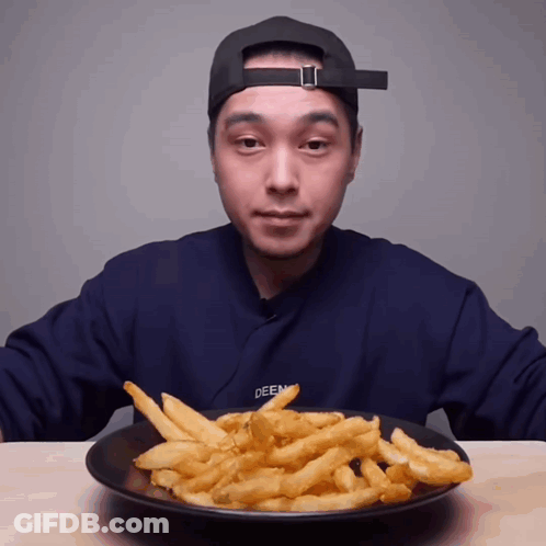 Man In Blue Sweater Deen Eating French Fries GIF