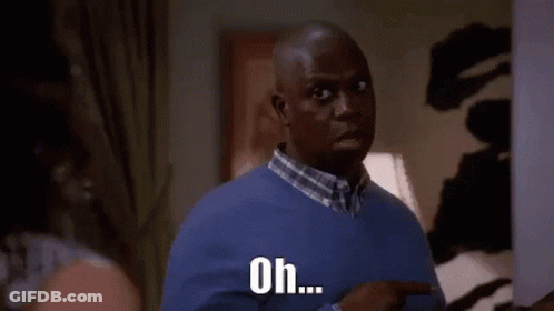 Man In Blue Sweater Pointing At Woman GIF
