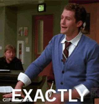 Man In Blue Sweater Saying Exactly At Piano GIF