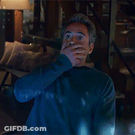 Man In Blue Sweater Standing With Hands Up GIF