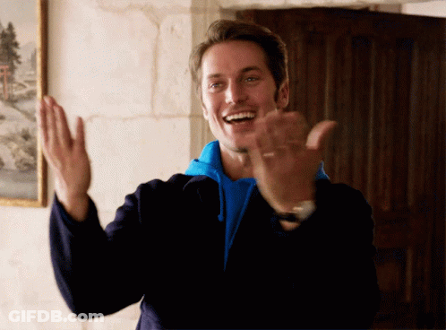 Man In Blue Sweatshirt And Black Jacket Applauds GIF