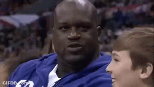 Man In Blue Sweatshirt Next To Young Boy In Stadium GIF