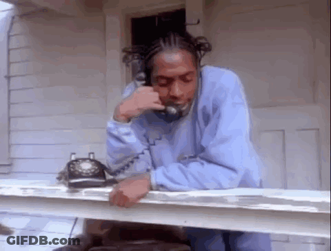 Man In Blue Sweatshirt Talking On Phone GIF