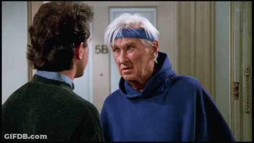 Man In Blue Sweatshirt Talking To Man GIF