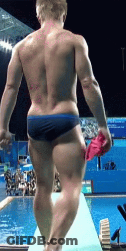 Man In Blue Swim Trunks On Diving Board GIF
