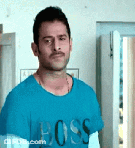 Man In Blue T-Shirt Saying Boss Standing In Front Of Door GIF