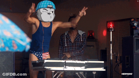 Man In Blue Tank Top And Red White Blue Trunks Dancing At Brother Keyboard GIF