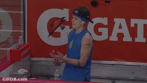 Man In Blue Tank Top In Front Of Gatorade Sign GIF