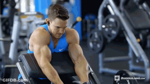 Man In Blue Tank Top Lifting Weights GIF