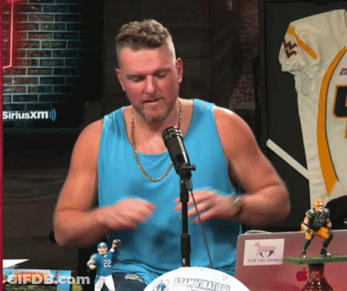Man In Blue Tank Top Sitting At SiriusXM Logo GIF