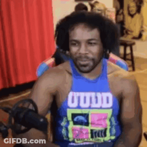 Man In Blue Tank Top With O'udd GIF