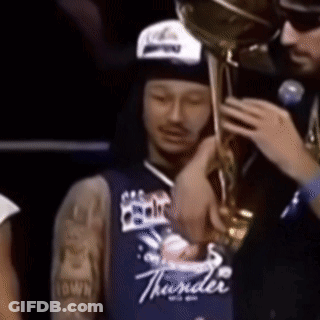Man In Blue Thunder Jersey Holding Trophy GIF
