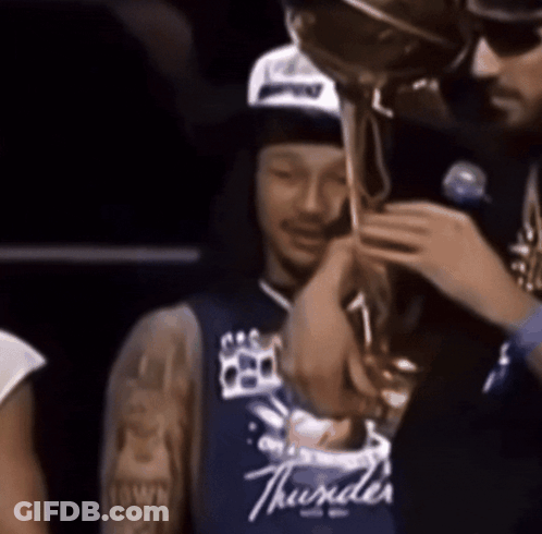 Man In Blue Thunder Jersey Holding Trophy GIF