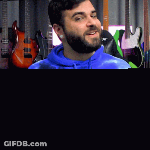 Man In Blue Tie Dye Hoodie Holding Guitar GIF