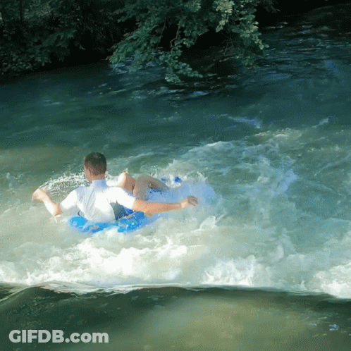 Man In Blue Tube Floating Down River GIF