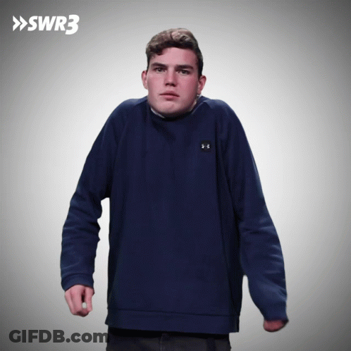 Man In Blue Under Armour Sweatshirt In Front Of SWR3 Sign GIF