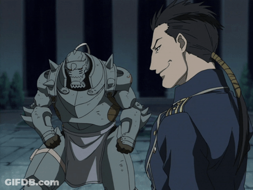 Man In Blue Uniform Standing Next To Robot GIF
