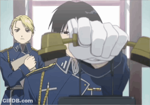 Man In Blue Uniform With Cross Collar Talking On Phone GIF