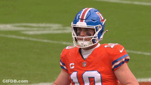 Man In Blue Uniform With Medal And Cross GIF