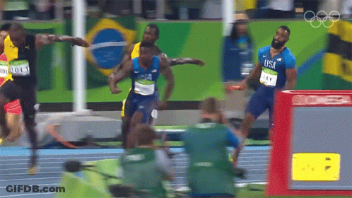 Man In Blue USA Shirt Running On Track GIF