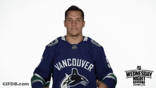 Man In Blue Vancouver Jersey Pointing To Chest GIF