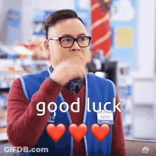Man In Blue Vest Glasses Saying Good Luck Hearts GIF
