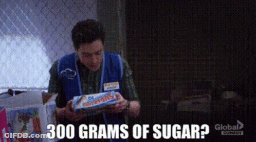 Man In Blue Vest Holding Tootsie Pops GIF