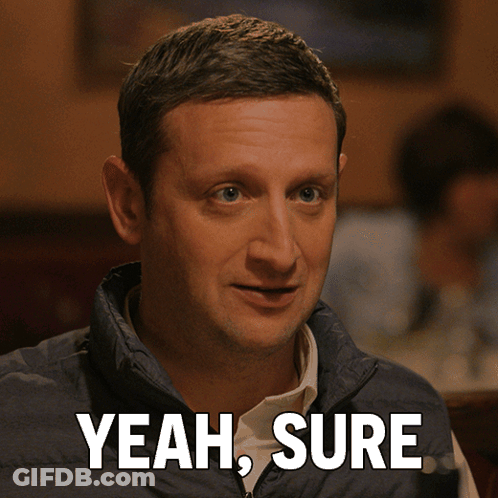 Man In Blue Vest Saying Yeah Sure GIF